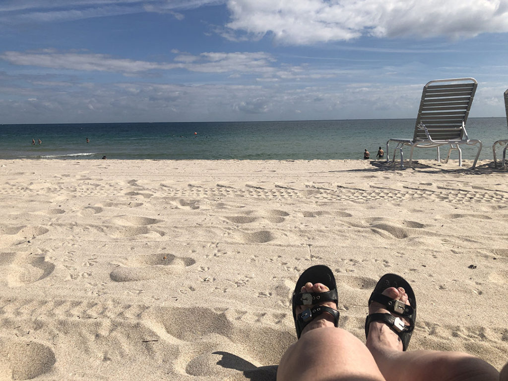 Feet in the sand on Fort Lauderdale Beach